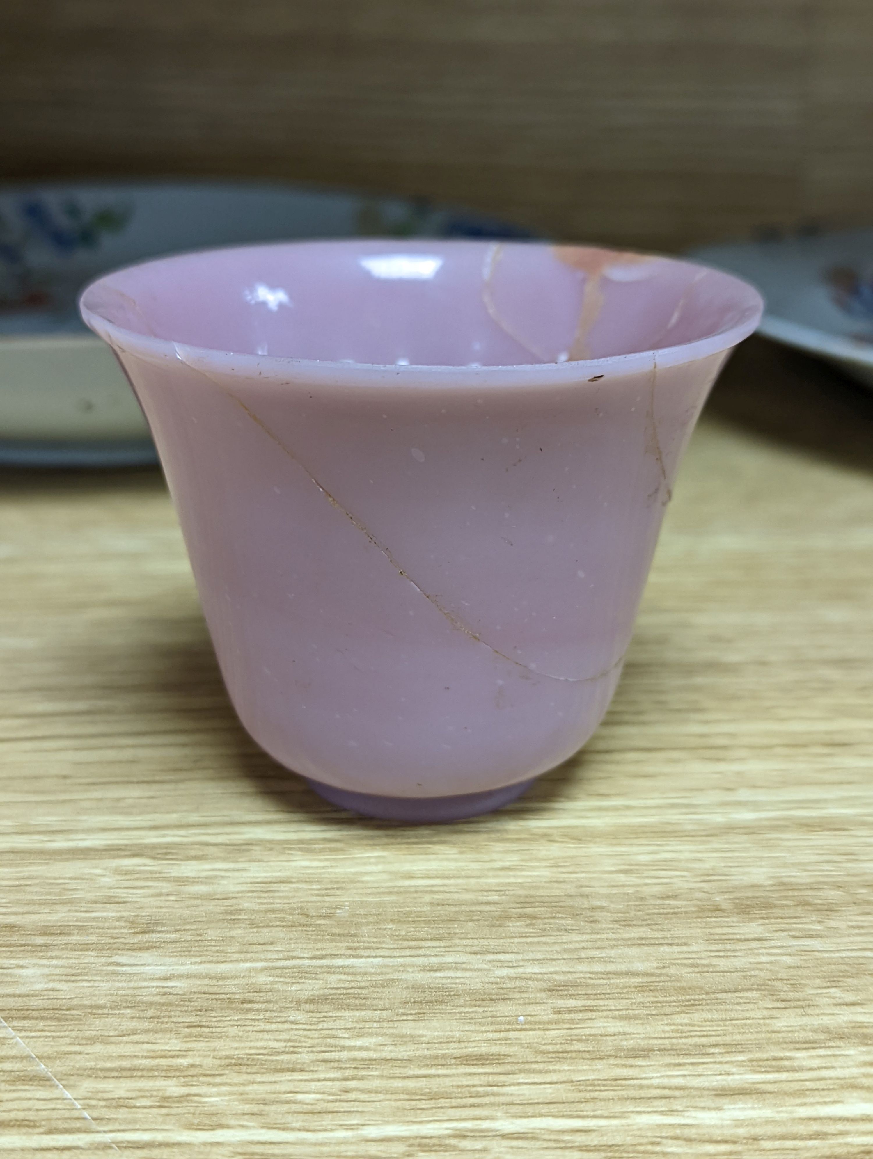 An 18th century Chinese famille rose dish, crackle-glaze stem cup, Beijing glass tea bowl and a Chinese Imari plate. Largest 24cm